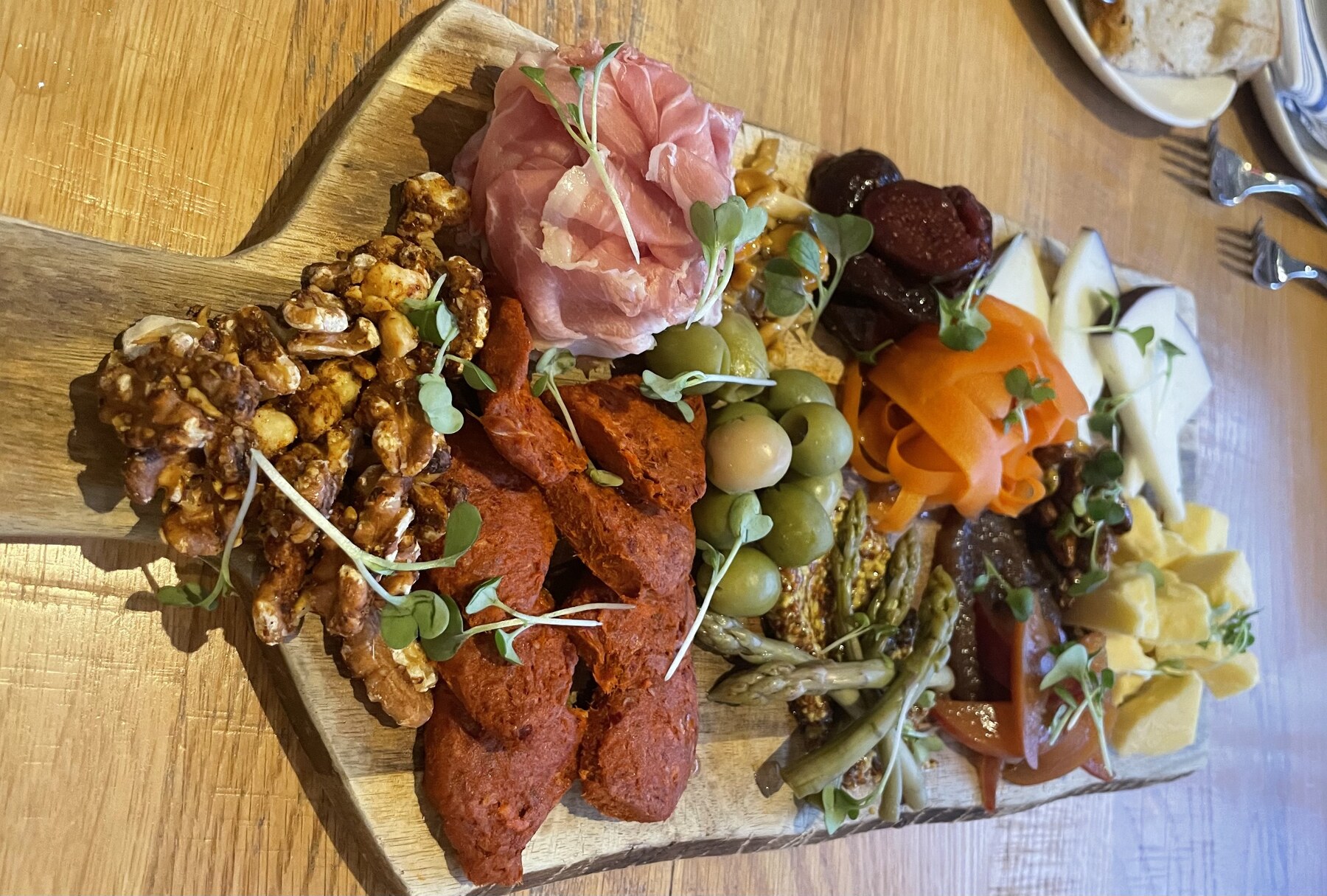 Luxurious shared platter with layered vegetables and garnishes