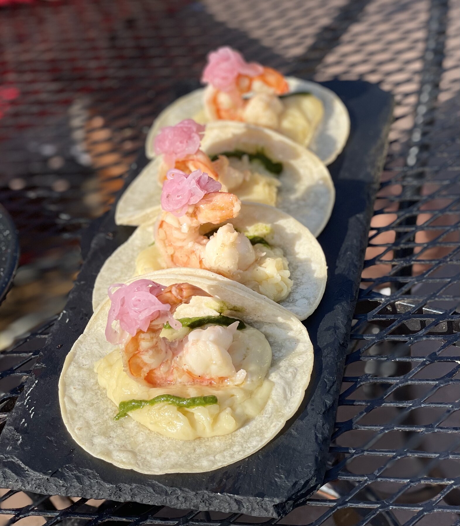 Modern sushi roll finished with colorful garnishes